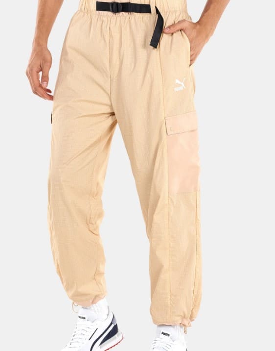 PUMA Men's SWxP Cargo Pants in beige, with a relaxed straight fit and water-repellent finish. An excellent choice for men seeking comfortable and breathable baggy cargo pants or streetwear cargo pants for men in Dubai's climate.