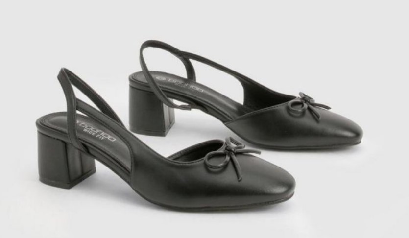 Black wide‑fit slingback ballet flats with a low block heel and a neat bow on each toe.