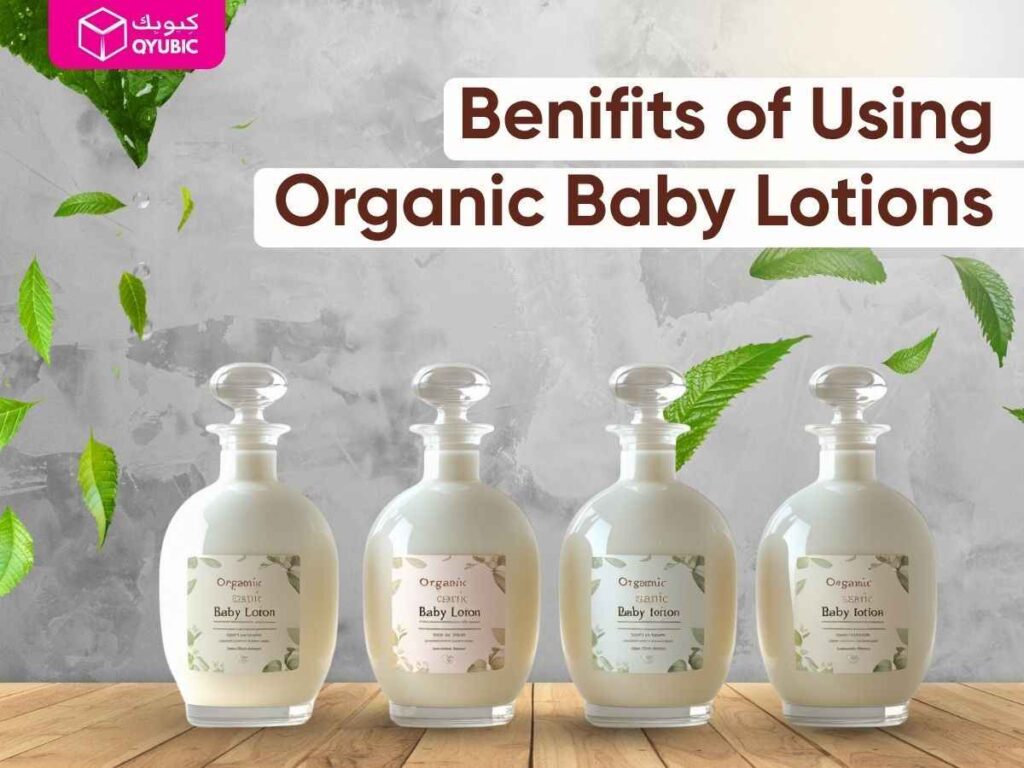 Four round glass bottles of organic baby lotion on a wooden table, floating green leaves, and the text ‘Benefits of Using Organic Baby Lotions’ with QYUBIC branding