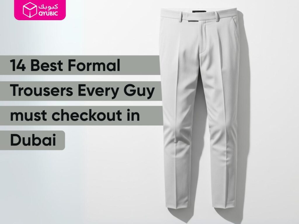 A pair of light grey Formal Trousers for Men hangs neatly against a light background. The trousers are creased down the front, showcasing their formal design. The image also contains a text overlay that reads "14 Best Formal Trousers Every Guy must checkout in Dubai," highlighting the relevance of these formal pants for men, suit pants, or a pant suit for man for the Dubai climate.