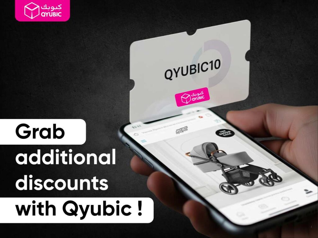 Hand holding a smartphone showing Mamas & Papas stroller page with floating QYUBIC10 coupon code for extra discounts.