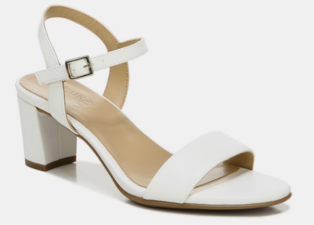 A heeled sandal with an ankle strap in white colour with a steady heel height for flat feet.