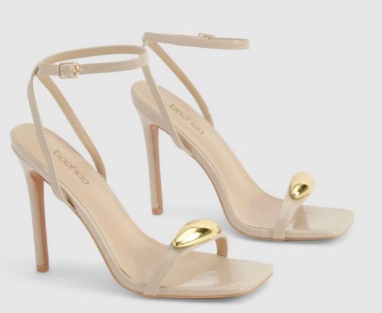 Metal Accent Nude stiletto heels with square toes and a gold-tone metal trim, offering a sleek and sculptural look from Boohoo.