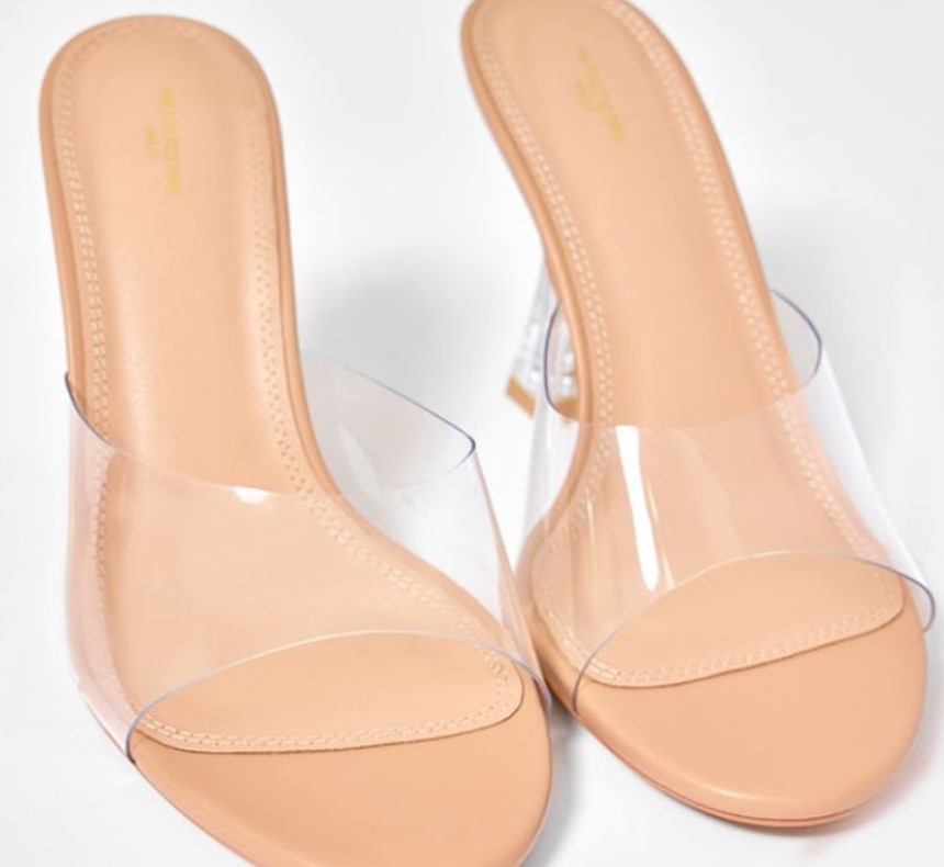 Alt Text for Clear Wide Heels:
Clear wide-strap stiletto heels from PrettyLittleThing, designed with transparent PVC to give a leg-lengthening, modern look.