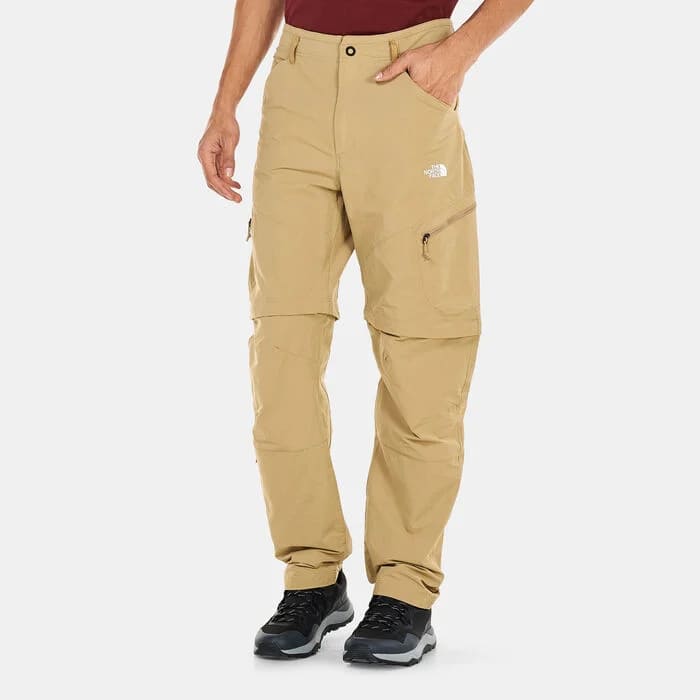 The North Face Men's Exploration Convertible Tapered Pants in beige, featuring FlashDry™ tech and convertible zip-off legs. Best for men seeking slim fit cargo pants or tactical cargo pants that offer adaptability for Dubai's climate.