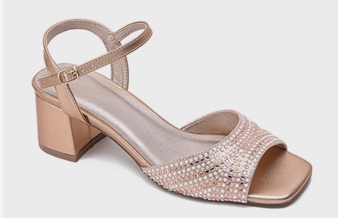 An embellished heeled sandal for flat feet is covered with a trending metallic colour