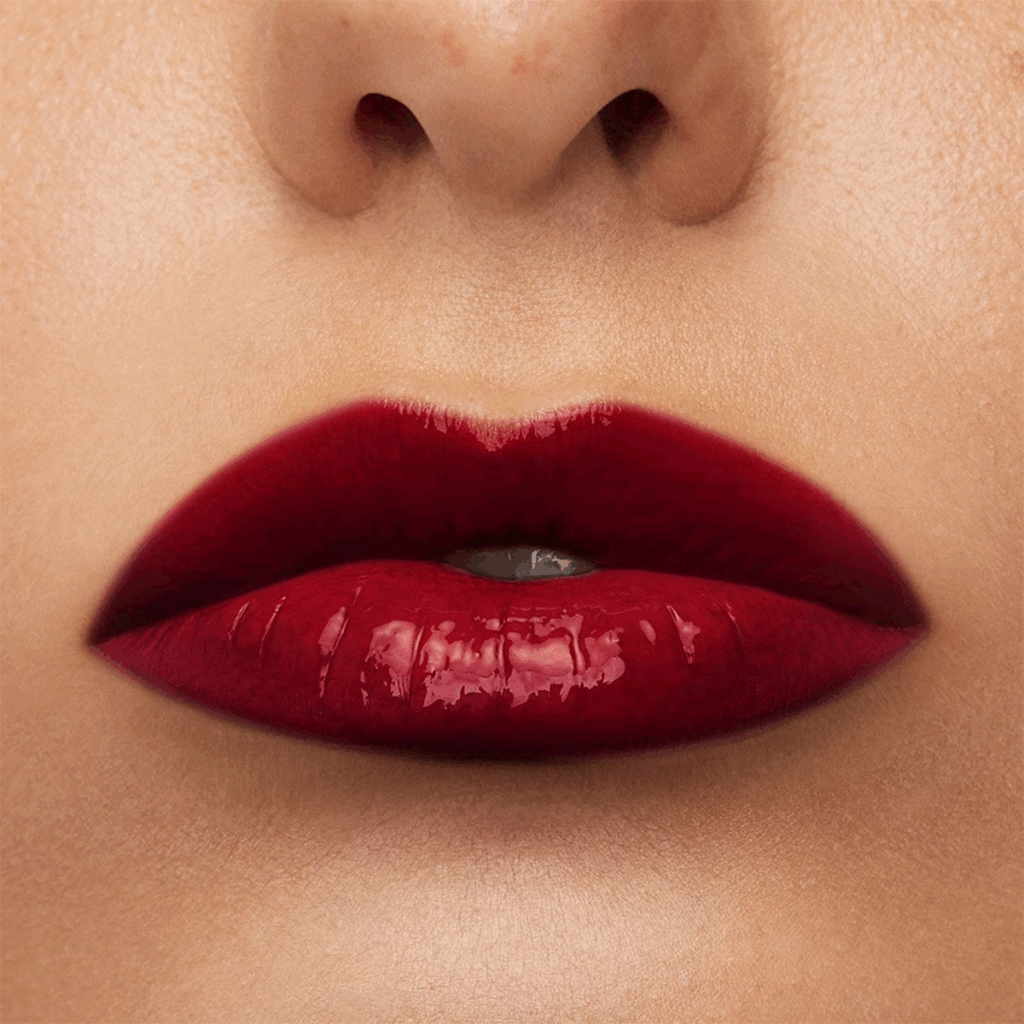 A glossy violet-wine lipstick with rich color payoff and longwear finish. Perfect for full lips on medium to morena skin, this high-pigment lipstick makes a bold statement while staying smudge-proof all day.