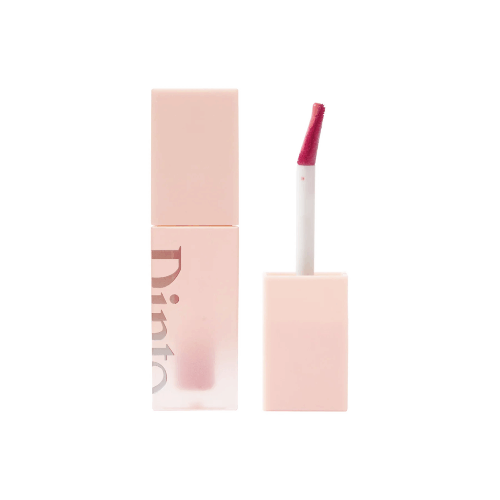 Light pink square bottle of Dinto Blur-Glowy Lip Tint with a soft pink applicator wand.
