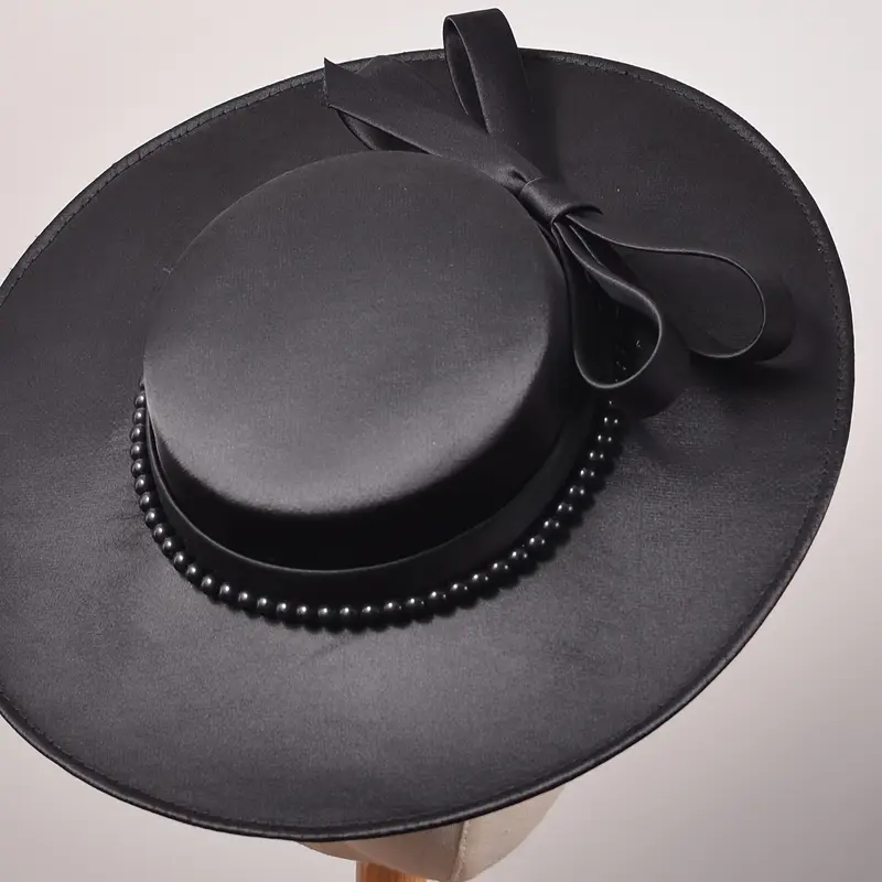 A fashionable black wide-brim hat, the perfect accessory for stylish Dubai World Cup outfits.