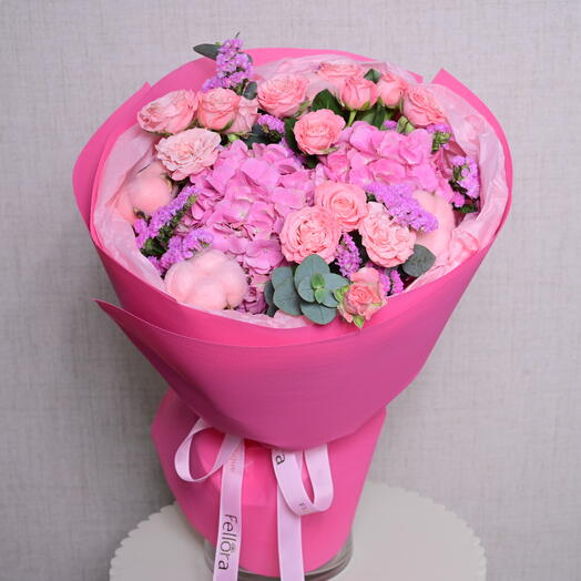 Elegant pink flower bouquet featuring a mix of roses, hydrangeas, and eucalyptus, perfect as one of the best anniversary flowers to celebrate love and romance.