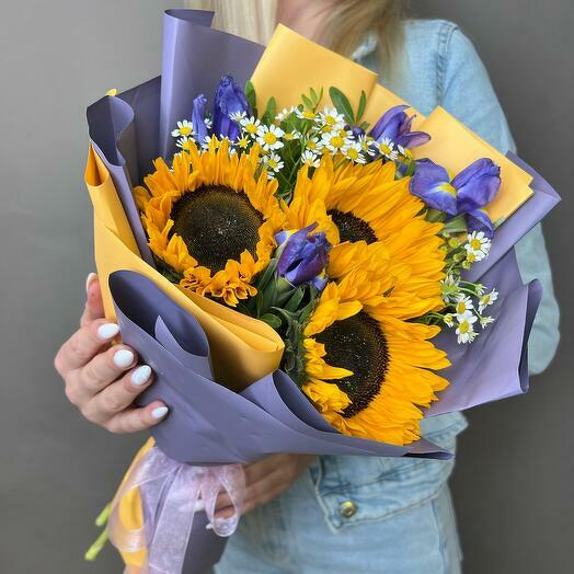 Bright and cheerful sunflower bouquet, beautifully paired with purple irises and white daisies. An ideal anniversary gift to brighten up a loved one's day with vibrant colors.