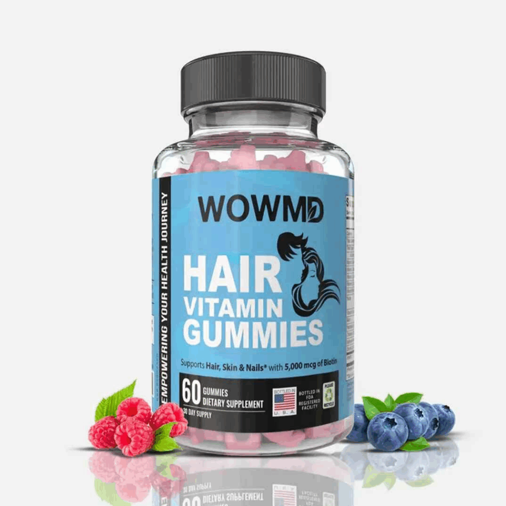  A bottle of WOWMD Hair Vitamin Gummies for adults, a biotin-rich supplement for hair, skin, and nails, displayed with fresh raspberries and blueberries.