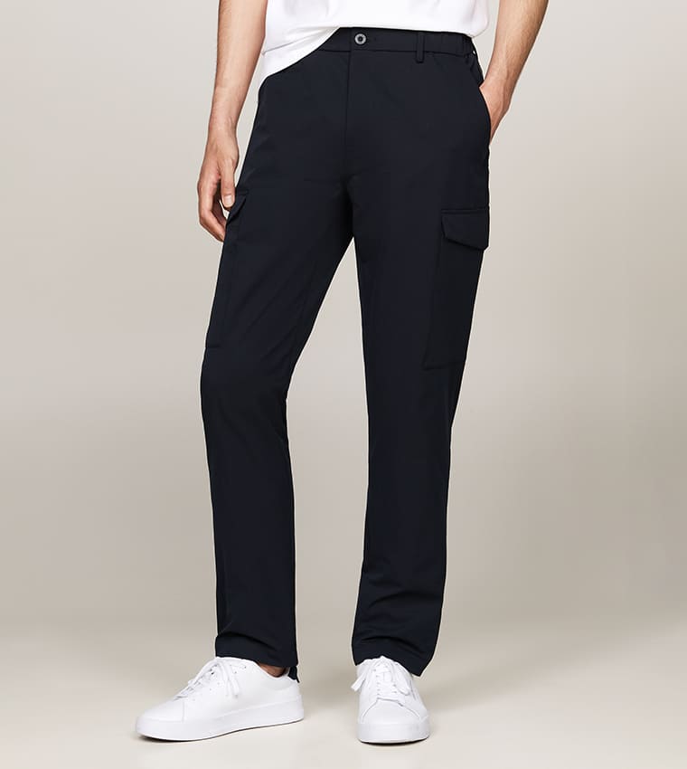 Tommy Hilfiger HARLEM Button Closure Cargo Pants in Desert Sky, offering moisture-wicking, anti-wrinkle, and odor control features. Perfect for men looking for polished yet comfortable cargo pants for men in Dubai, suitable for both style and heat.